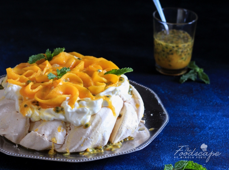 Mango Passion Fruit Pavlova - crispy pavlova crust, marshmallow center, topped with whipped cream, mangoes and passion fruit. Mango Pavlova Recipe. Mango Desserts Recipes